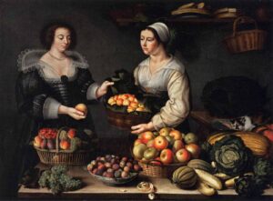 A still-life portrait of two women standing behind a large table covered in an abundance of different fruits, vegetables, and baskets. One woman is a produce seller, offering a basket of oranges up to a finely dressed woman for inspection. 